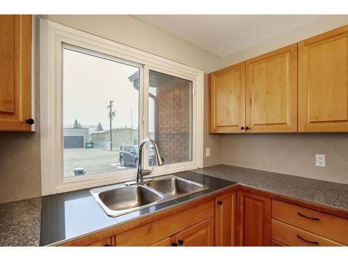 4515 48 Street, Innisfail, AB - Indoor Photo Showing Kitchen With Double Sink