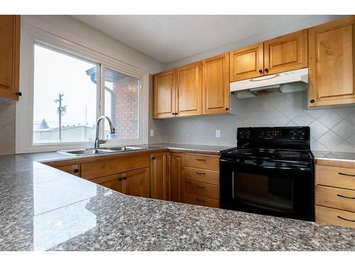 4515 48 Street, Innisfail, AB - Indoor Photo Showing Kitchen With Double Sink