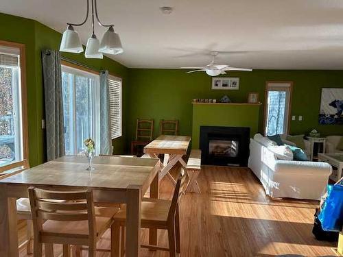 4804 Lake Street, Alix, AB - Indoor Photo Showing Dining Room With Fireplace