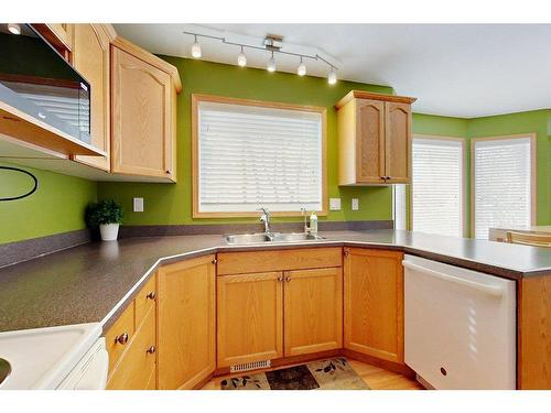 4804 Lake Street, Alix, AB - Indoor Photo Showing Kitchen With Double Sink