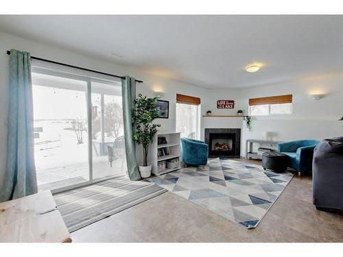 4804 Lake Street, Alix, AB - Indoor Photo Showing Living Room With Fireplace