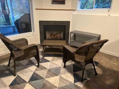 4804 Lake Street, Alix, AB - Indoor Photo Showing Living Room With Fireplace