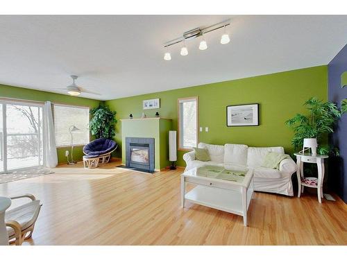 4804 Lake Street, Alix, AB - Indoor Photo Showing Living Room With Fireplace