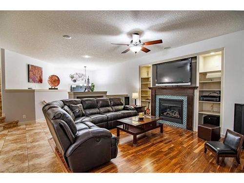 100 Vincent Close, Red Deer, AB - Indoor Photo Showing Living Room With Fireplace