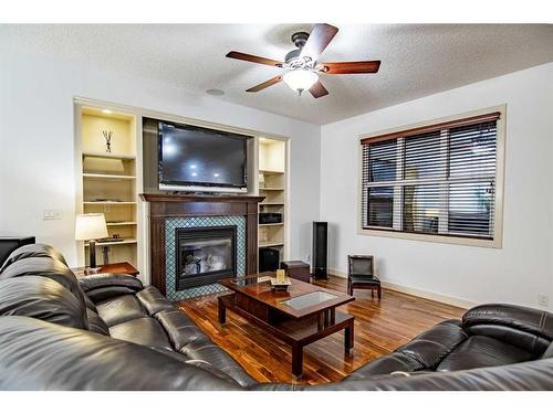 100 Vincent Close, Red Deer, AB - Indoor Photo Showing Living Room With Fireplace