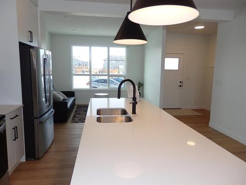 45 Inglis Crescent, Sylvan Lake, AB - Indoor Photo Showing Kitchen With Double Sink