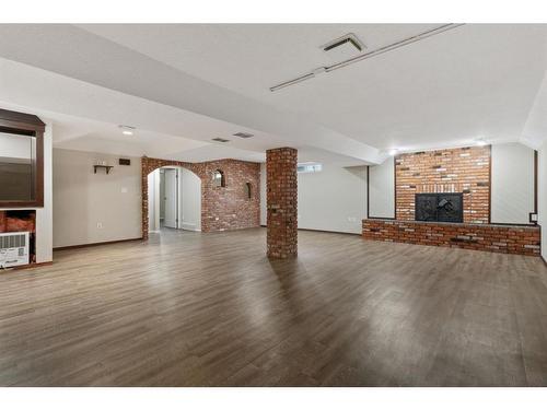 112 Sanden Street, Bawlf, AB - Indoor Photo Showing Other Room With Fireplace