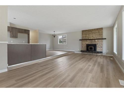 112 Sanden Street, Bawlf, AB - Indoor Photo Showing Living Room With Fireplace