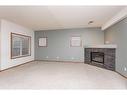 19 Jones Crescent, Red Deer, AB  - Indoor With Fireplace 