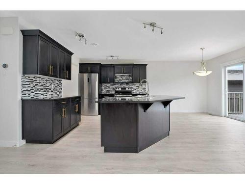 28 Almond Crescent, Blackfalds, AB - Indoor Photo Showing Kitchen With Stainless Steel Kitchen With Upgraded Kitchen