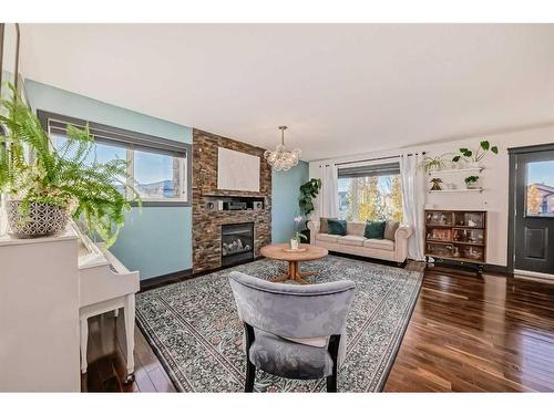 2 Grove Close, Red Deer, AB - Indoor Photo Showing Living Room With Fireplace