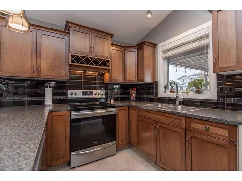 80 Trimble Close, Red Deer, AB - Indoor Photo Showing Kitchen With Double Sink