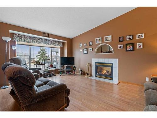 13 Westwood Court South, Sylvan Lake, AB - Indoor Photo Showing Living Room With Fireplace