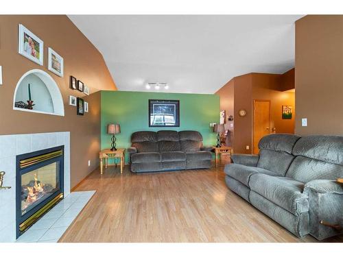 13 Westwood Court South, Sylvan Lake, AB - Indoor Photo Showing Living Room With Fireplace