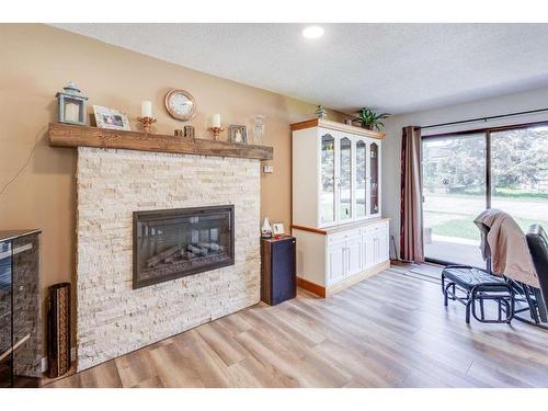 5416 50 Street, Rimbey, AB - Indoor Photo Showing Living Room With Fireplace