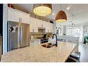 108-5210 Lakeshore Drive, Sylvan Lake, AB  - Indoor Photo Showing Kitchen With Double Sink With Upgraded Kitchen 