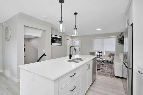 54 Irvin Way, Sylvan Lake, AB - Indoor Photo Showing Kitchen With Double Sink With Upgraded Kitchen