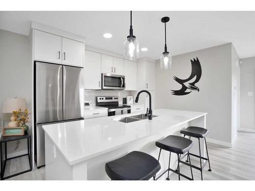 54 Irvin Way, Sylvan Lake, AB - Indoor Photo Showing Kitchen With Stainless Steel Kitchen With Double Sink With Upgraded Kitchen