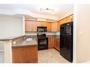 104-69 Ironstone Drive, Red Deer, AB  - Indoor Photo Showing Kitchen With Double Sink 