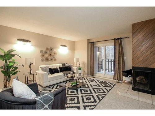 7-80 Piper Drive, Red Deer, AB - Indoor Photo Showing Living Room With Fireplace