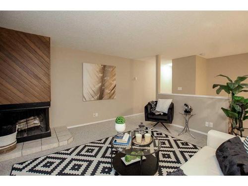 7-80 Piper Drive, Red Deer, AB - Indoor Photo Showing Living Room With Fireplace