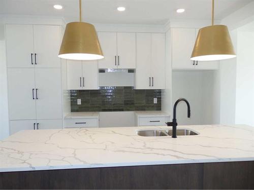 2 A Evergreen Way, Red Deer, AB - Indoor Photo Showing Kitchen With Double Sink