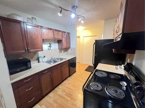 204-7164 Parke Avenue, Red Deer, AB - Indoor Photo Showing Kitchen With Double Sink