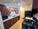 204-7164 Parke Avenue, Red Deer, AB  - Indoor Photo Showing Kitchen With Double Sink 