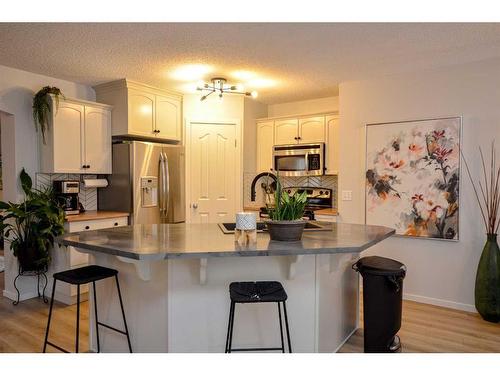 62 Joice Close, Red Deer, AB - Indoor Photo Showing Kitchen With Upgraded Kitchen