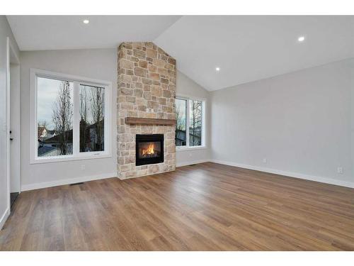 101-5300 60 Street, Sylvan Lake, AB - Indoor Photo Showing Living Room With Fireplace