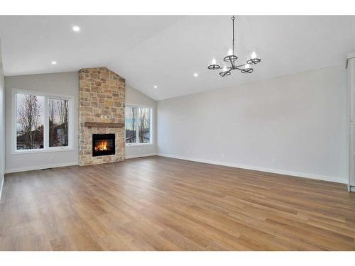 101-5300 60 Street, Sylvan Lake, AB - Indoor Photo Showing Living Room With Fireplace