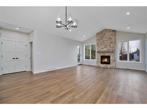 101-5300 60 Street, Sylvan Lake, AB - Indoor Photo Showing Living Room With Fireplace