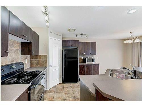 195 Ibbotson Close, Red Deer, AB - Indoor Photo Showing Kitchen With Double Sink