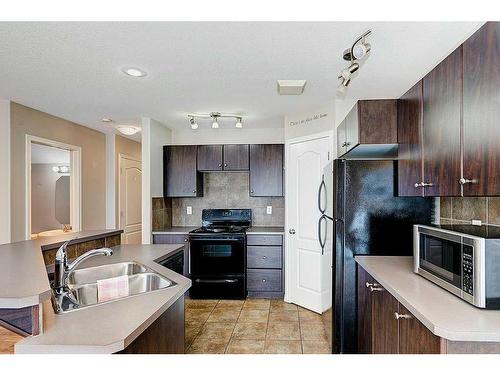 195 Ibbotson Close, Red Deer, AB - Indoor Photo Showing Kitchen With Double Sink