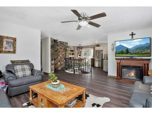 391083   6-5 Range Road, Rural Clearwater County, AB - Indoor Photo Showing Living Room With Fireplace