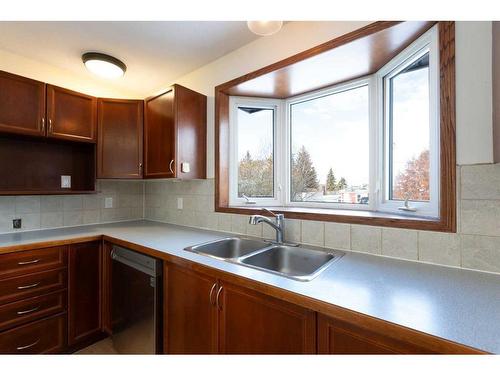 840 Osler Street, Carstairs, AB - Indoor Photo Showing Kitchen With Double Sink