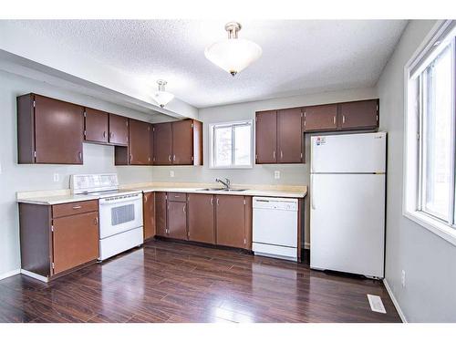 A-3 Grant Street, Red Deer, AB - Indoor Photo Showing Kitchen With Double Sink