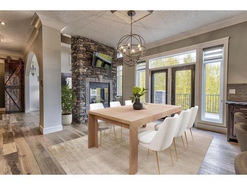 23 Bannerman Close, Red Deer, AB - Indoor Photo Showing Dining Room With Fireplace