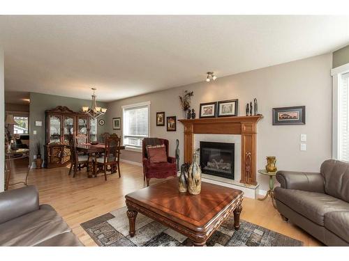 14 Pickwick Lane, Lacombe, AB - Indoor Photo Showing Living Room With Fireplace