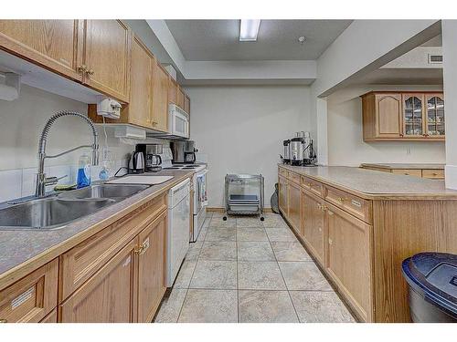 209-4512 52 Avenue, Red Deer, AB - Indoor Photo Showing Kitchen With Double Sink