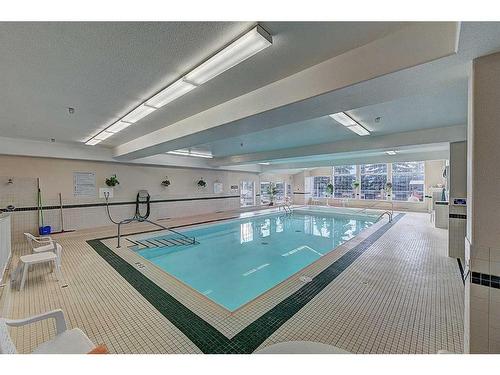 209-4512 52 Avenue, Red Deer, AB - Indoor Photo Showing Other Room With In Ground Pool