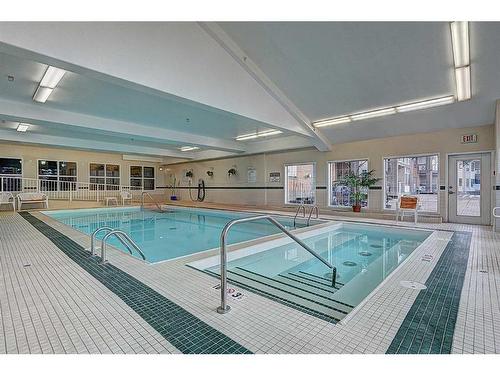 209-4512 52 Avenue, Red Deer, AB - Indoor Photo Showing Other Room With In Ground Pool