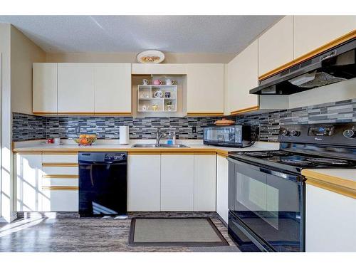 81 Kirsch Close, Red Deer, AB - Indoor Photo Showing Kitchen With Double Sink