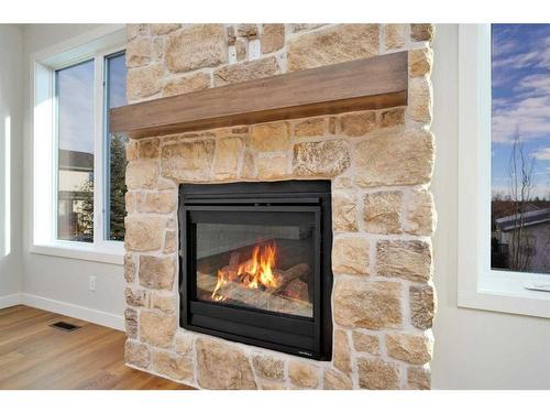 102-5300 60 Street, Sylvan Lake, AB - Indoor Photo Showing Living Room With Fireplace