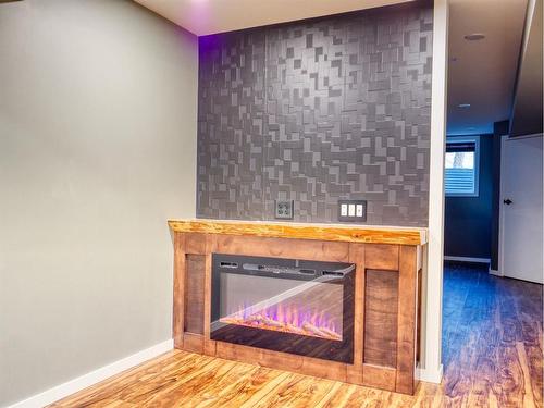 412 4 Avenue, Elnora, AB - Indoor Photo Showing Other Room With Fireplace