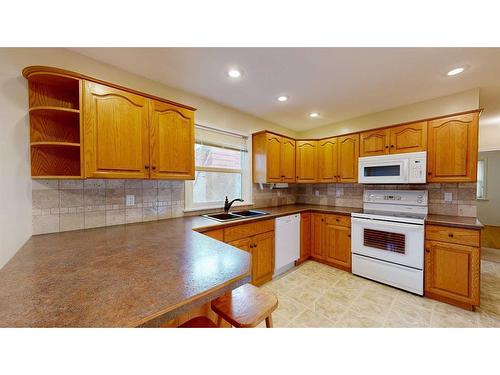 4719 53 Street, Stettler, AB - Indoor Photo Showing Kitchen With Double Sink