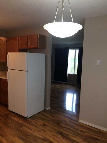 4715 & 4717 50 Street, Caroline, AB - Indoor Photo Showing Kitchen