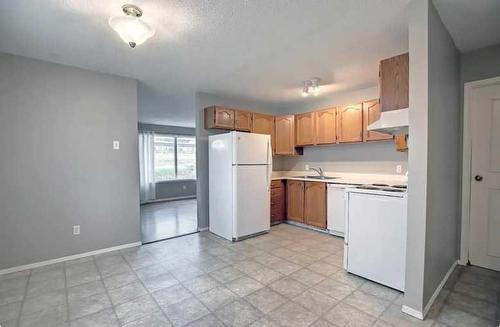 4715 & 4717 50 Street, Caroline, AB - Indoor Photo Showing Kitchen