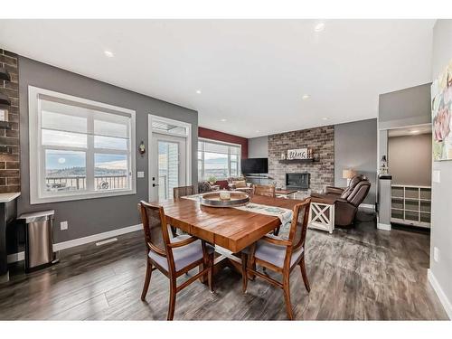 82 Mitchell Crescent, Blackfalds, AB - Indoor Photo Showing Dining Room With Fireplace