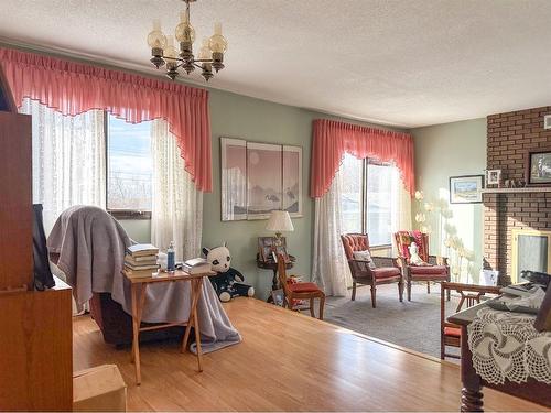 5319 Robinson Place, Bashaw, AB - Indoor Photo Showing Living Room With Fireplace